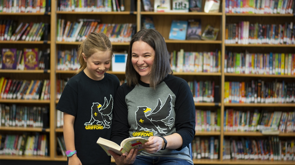 St. Angela Griffons teacher and student in the library