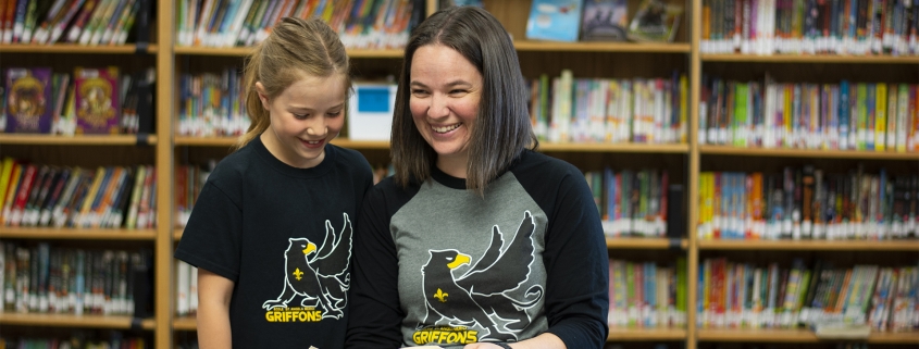 St. Angela Griffons teacher and student in the library